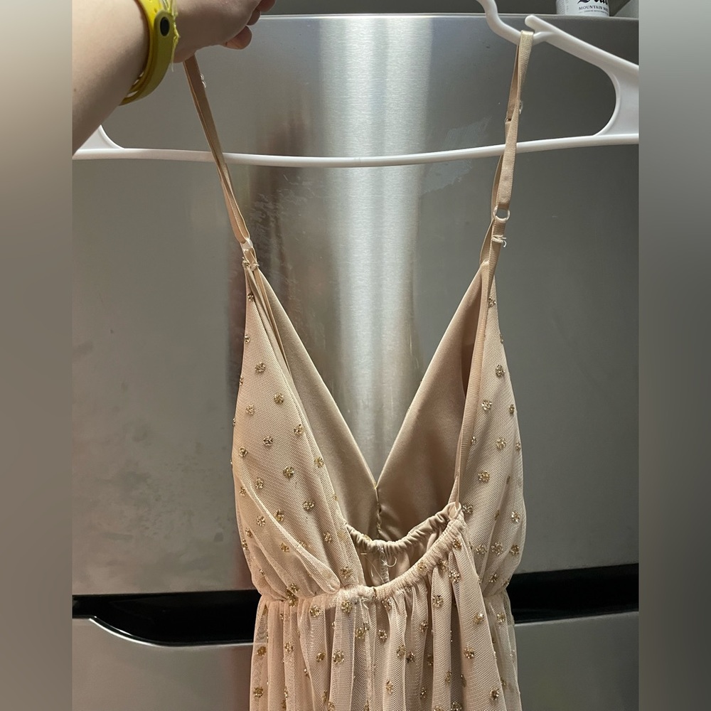 Dress made in Italy, size very versatile, I’m a medium but this really stretches